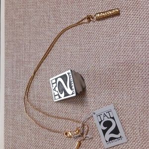 Tat2 gold tone rod necklace
